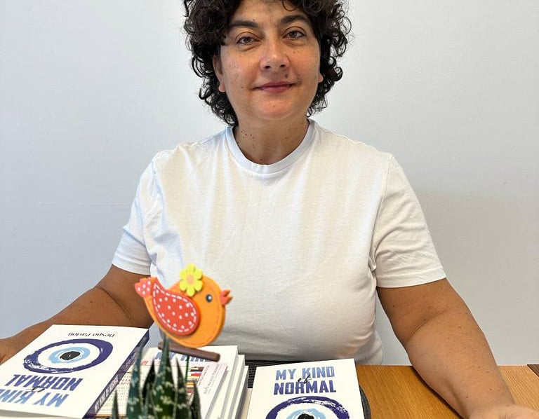 diaspora1-Despo-Pavlou-with-copies-of-her-latest-book.jpg