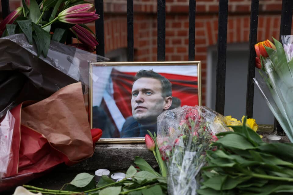 Flowers-and-a-portrait-of-late-Russian-opposition-leader-Alexei-Navalny-are-left-outside-the-R...jpg