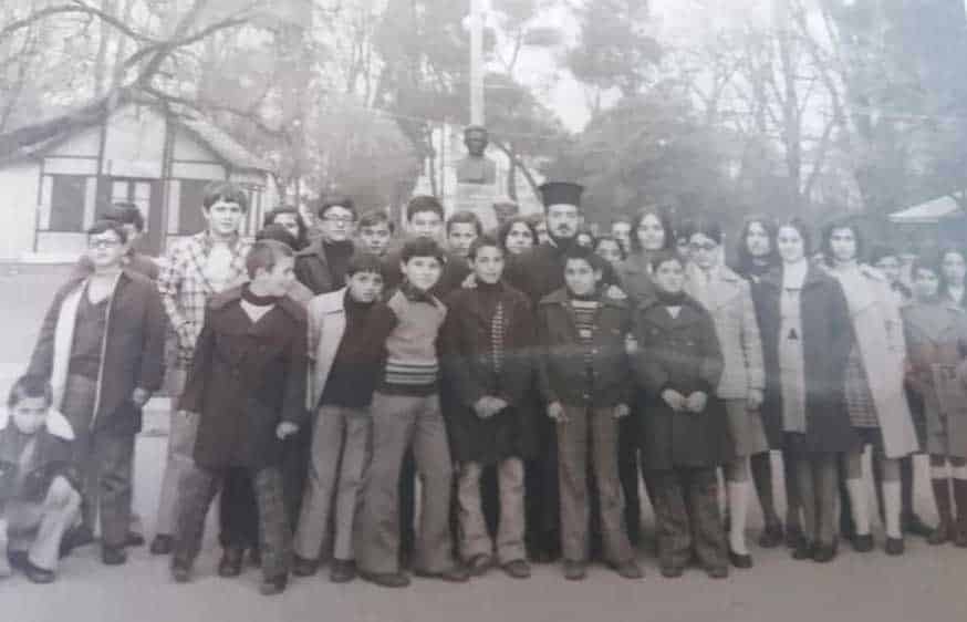feature-nik-main-Children-with-a-priest-in-Greece-after-they-arrived.jpg