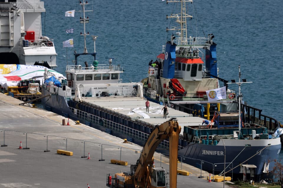 Members-of-the-crew-work-on-a-cargo-ship-loaded-with-humanitarian-aid-for-Gaza-at-the-port-of-...jpg